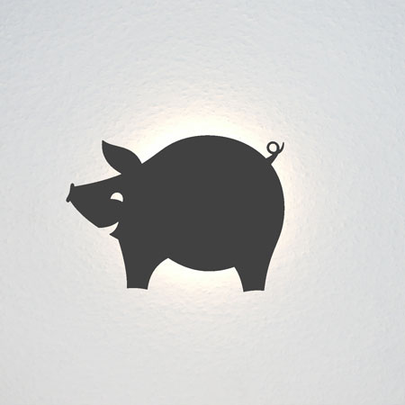 Ein lachendes, rundes Schweinchen.
